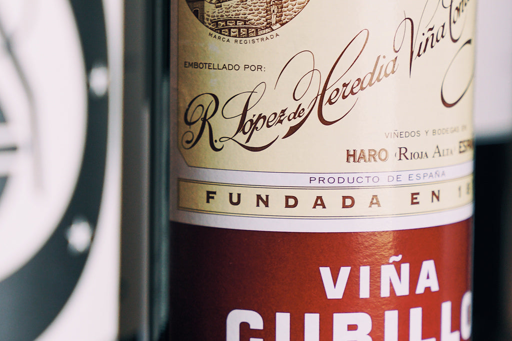 Lopez de Heredia wine bottle 'Viña Cubillo' label on a dark background