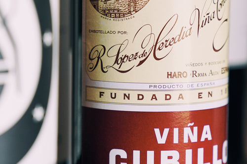 Lopez de Heredia wine bottle 'Viña Cubillo' label on a dark background