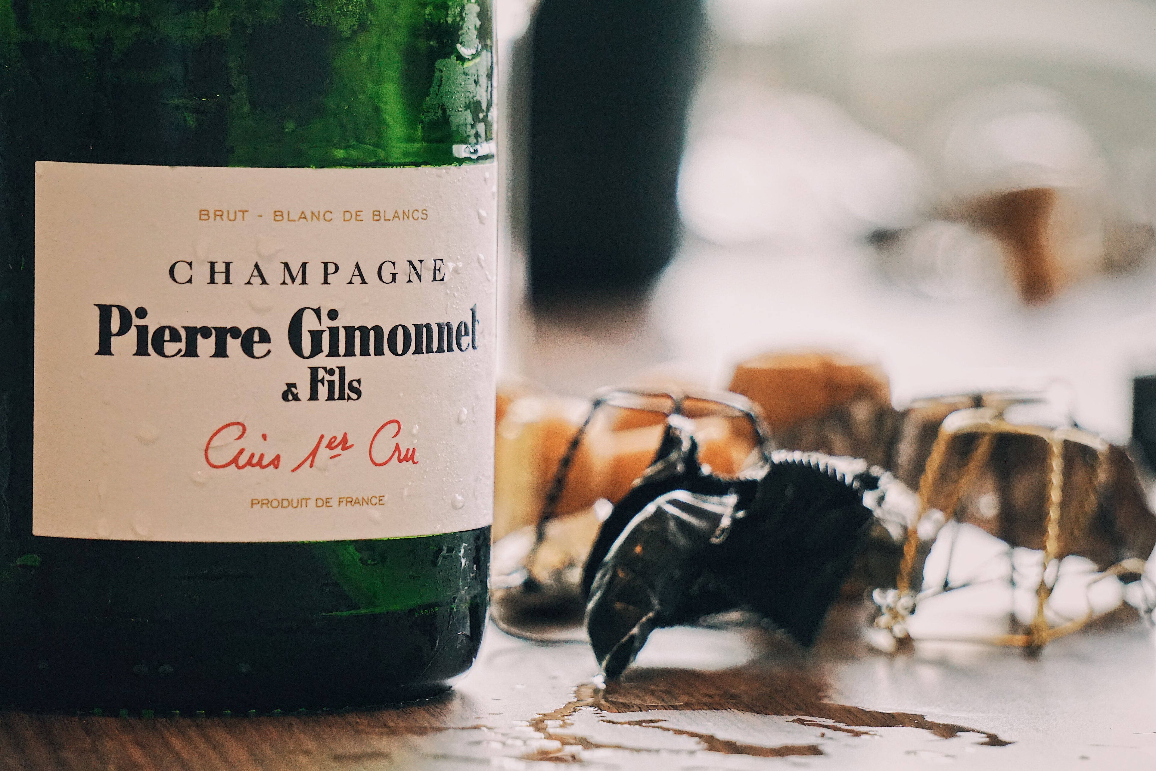 Bottle of Pierre Gimonnet & Fils champagne with blurred background